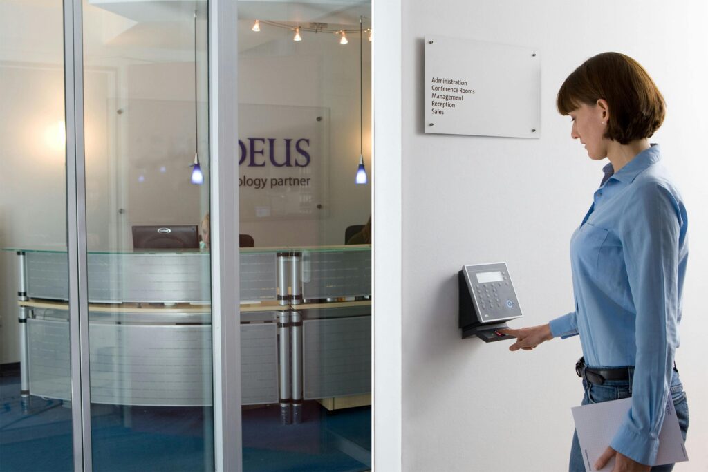 Employee using biometric scanner to access facility