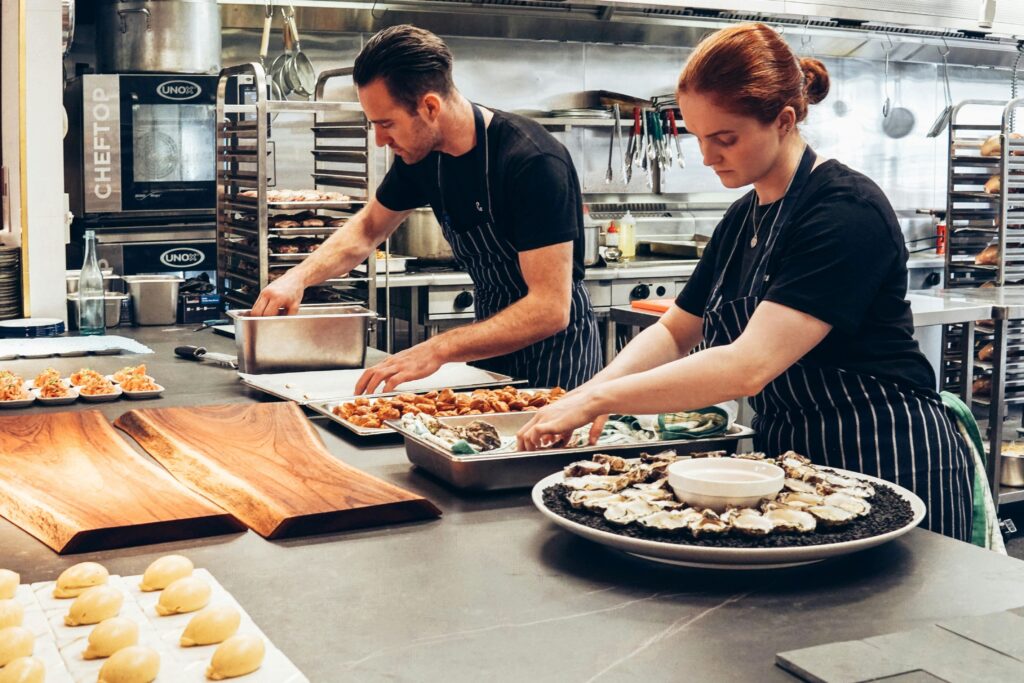 employees assembling food platters; small business